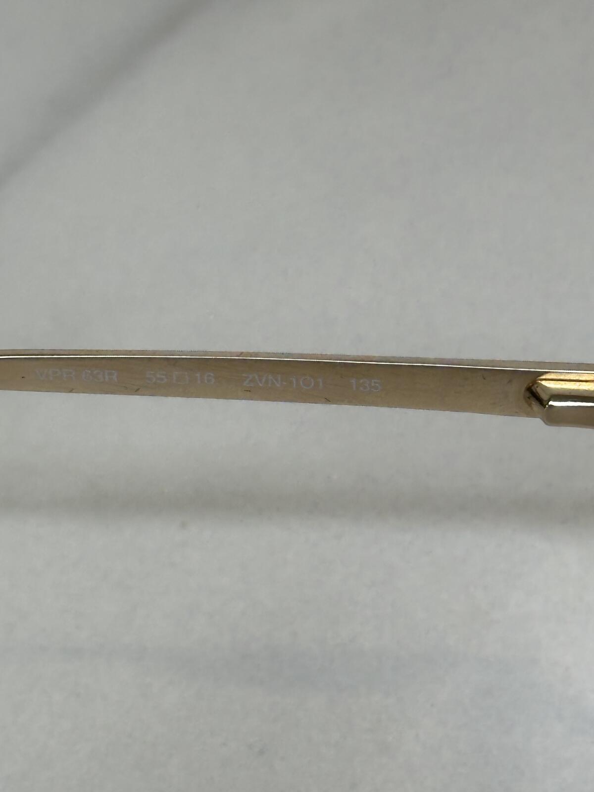 Prada VPR 03R gold tone cat-eye eyeglasses 55-16-135